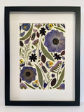 Dusk pressed flower artwork in a black frame