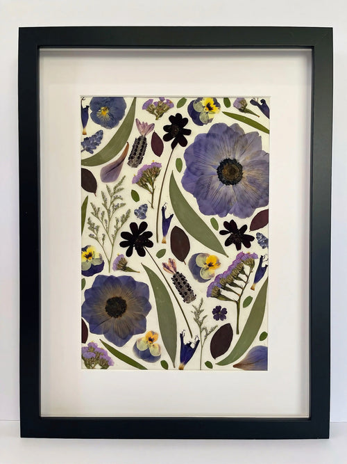 Dusk pressed flower artwork in a black frame