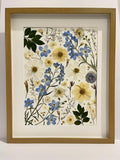 Reverie pressed flower artwork in a light oak frame