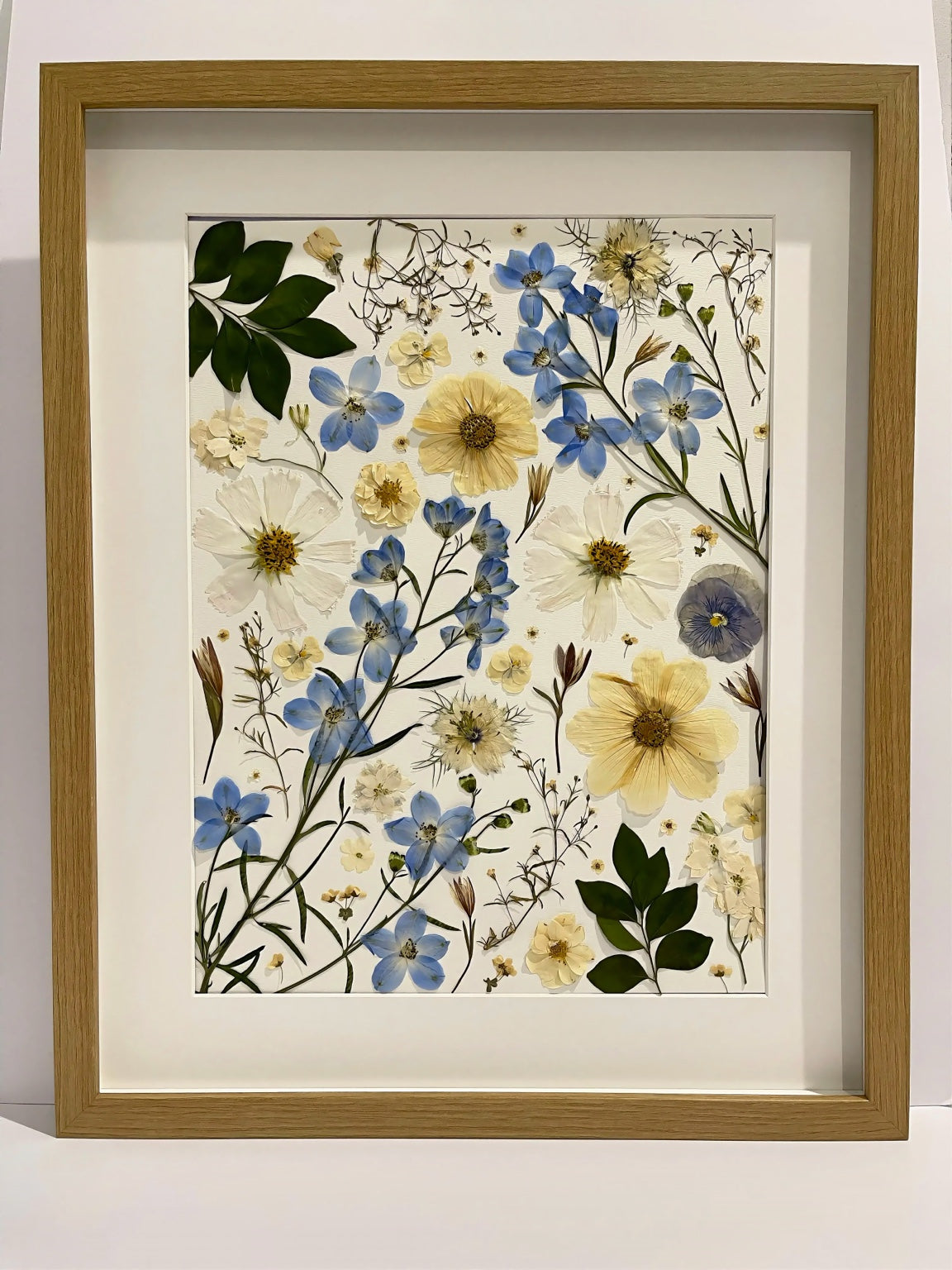 Reverie pressed flower artwork in a light oak frame