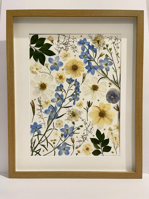 Reverie pressed flower artwork in a light oak frame
