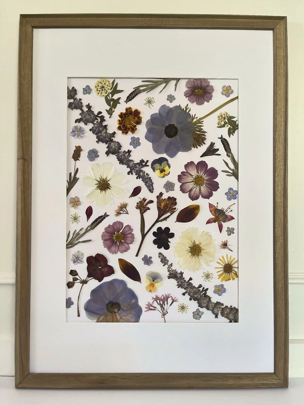 Windflower pressed flower artwork in a timber frame